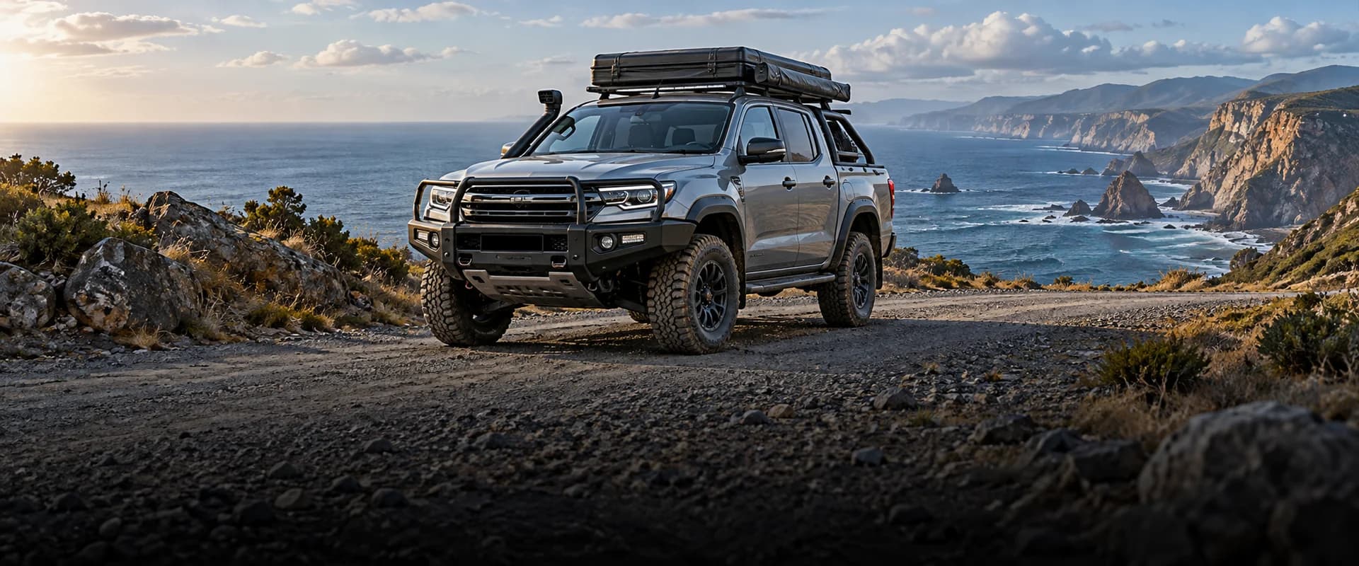 Expedition pickup beside a remote coastline